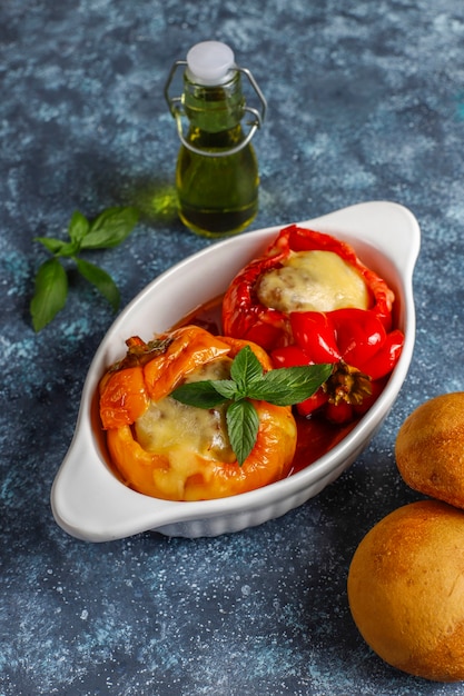 Free photo colorful baked with cheese, stuffed peppers with minced meat.