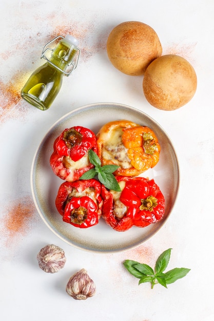 Free photo colorful baked with cheese, stuffed peppers with minced meat.