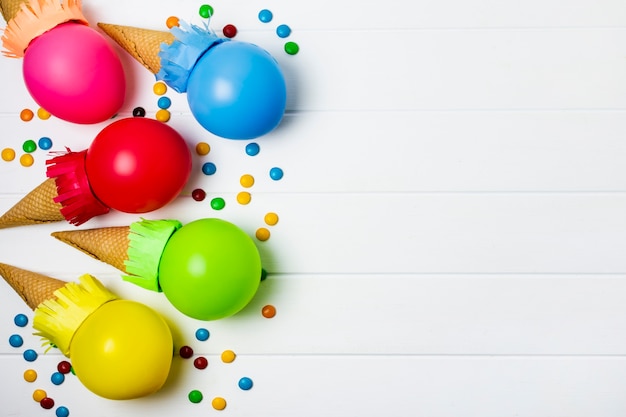 Colorful balloons ice cream on white background with copy space