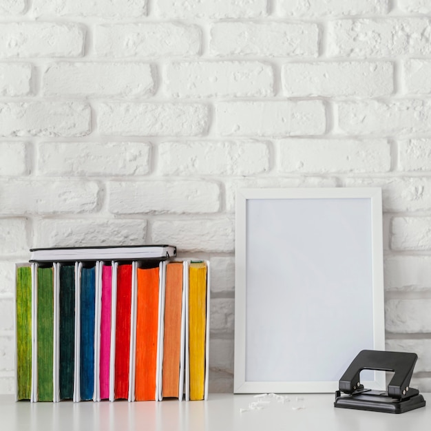 Free Photo colorful books and board on table