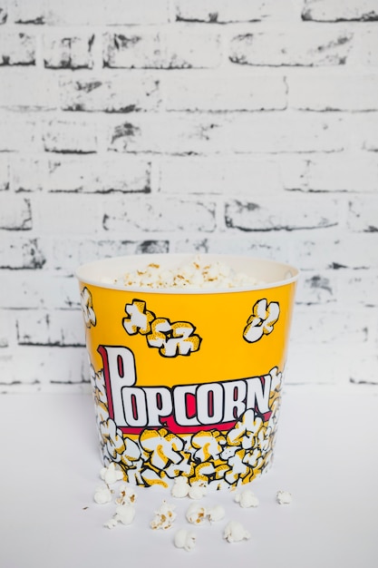 Free photo colorful bucket of popcorn on white