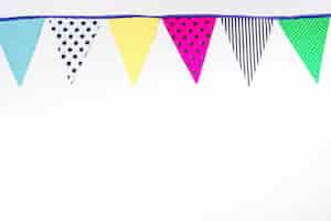 Free photo colorful bunting flags on white background