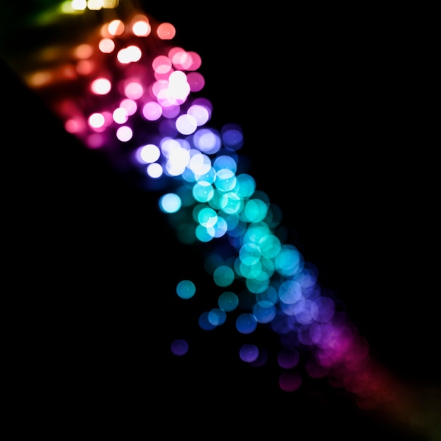 Free photo colorful christmas light against black background