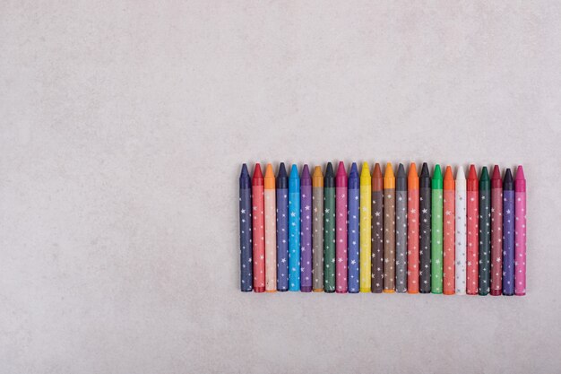 Colorful crayons on white background