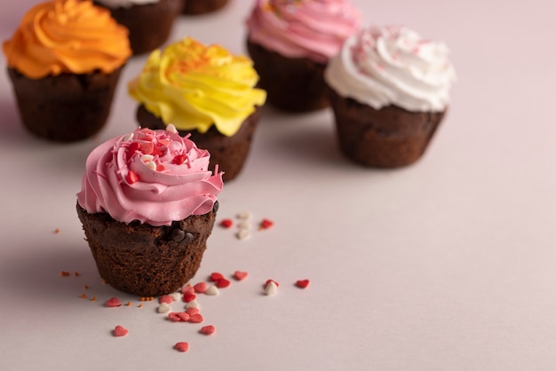 Free Photo colorful cupcakes with delicious frosting