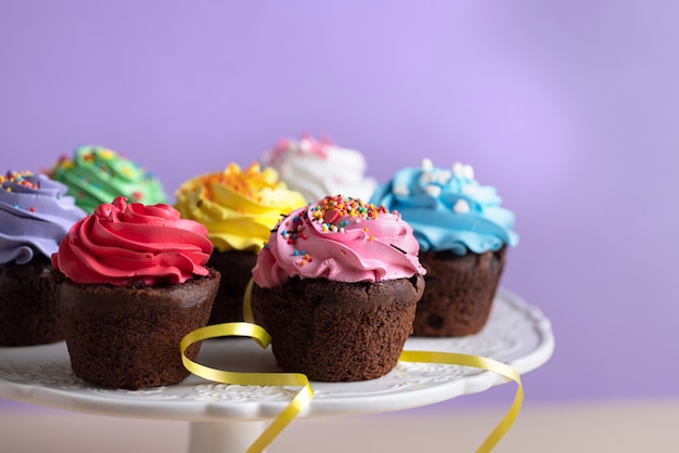 Free Photo colorful cupcakes with delicious frosting