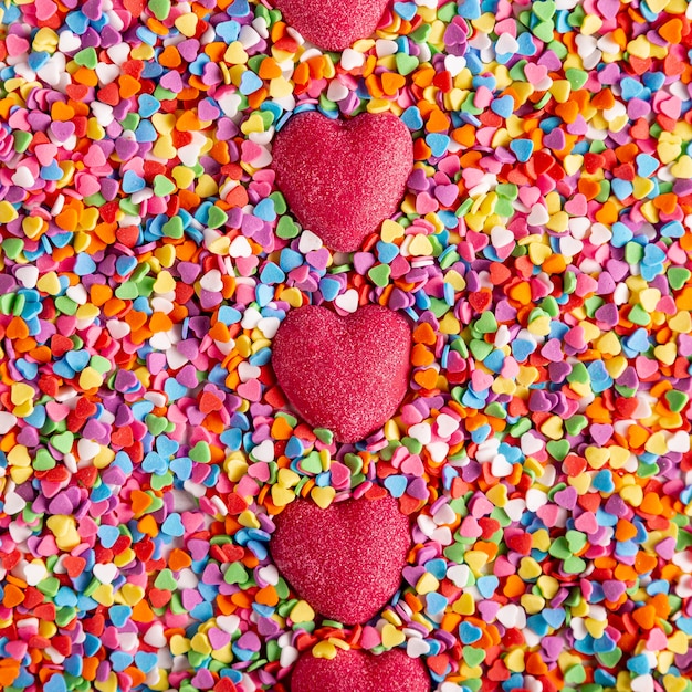 Colorful delicious heart candies top view