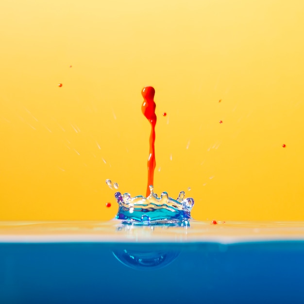 Free photo colorful drop falling in water