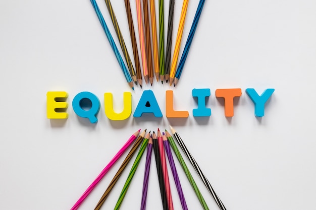 Free Photo colorful equality lettering with pencils