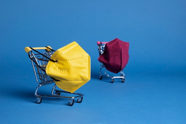 Free photo colorful ffp2 masks and shopping carts