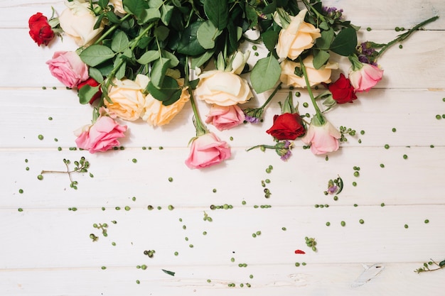 Free Photo colorful flowers on wooden table