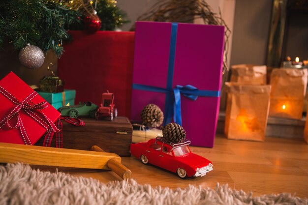 Colorful gifts and a red toy car