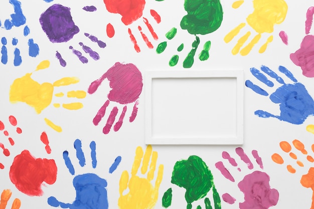 Free Photo colorful hands on white background with empty frame