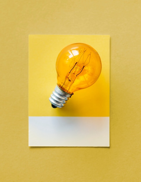 Colorful light bulb on a paper