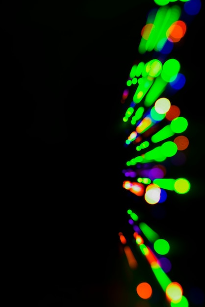 Free photo colorful lights background with copyspace on left