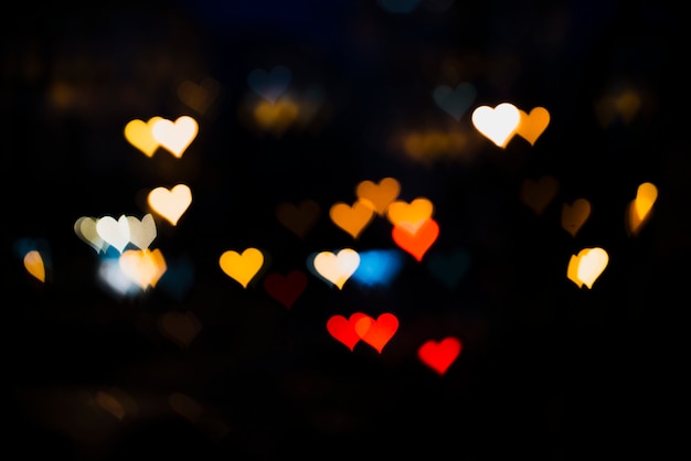 Free photo colorful lights background with heart shapes