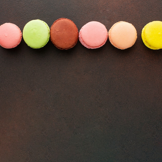 Free photo colorful macarons with copy space