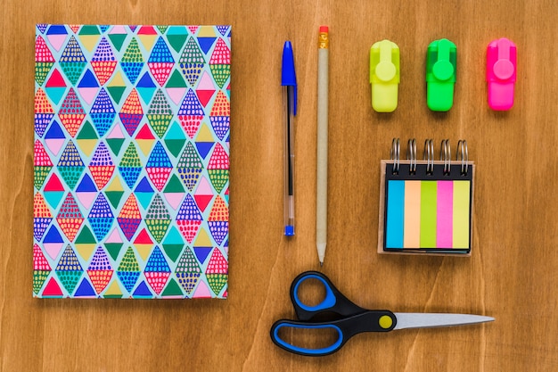 Free photo colorful and organized wooden desk