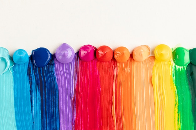 Colorful paint trails on white background