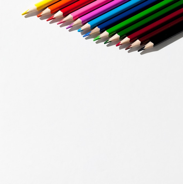 Colorful pencils on white background