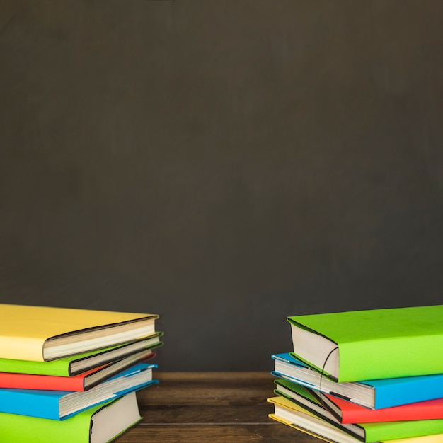 Colorful piles of books on table