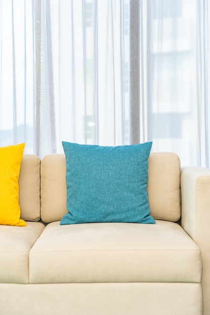 Free Photo colorful pillows on beige sofa