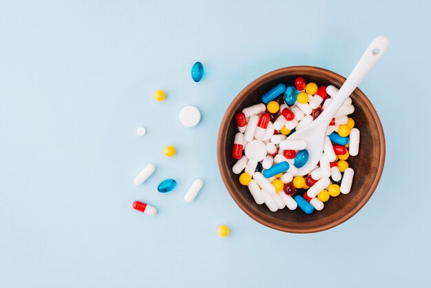 Colorful pills in bowl