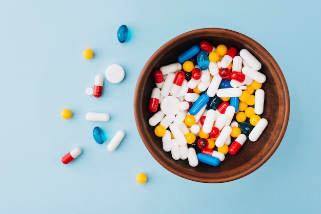 Colorful pills in bowl