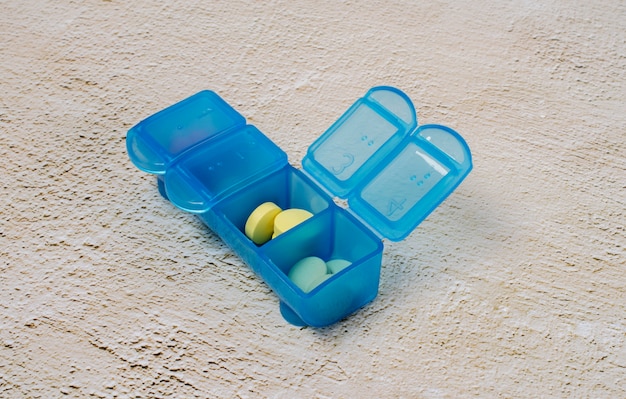 Free photo colorful pills in box arrangement high angle