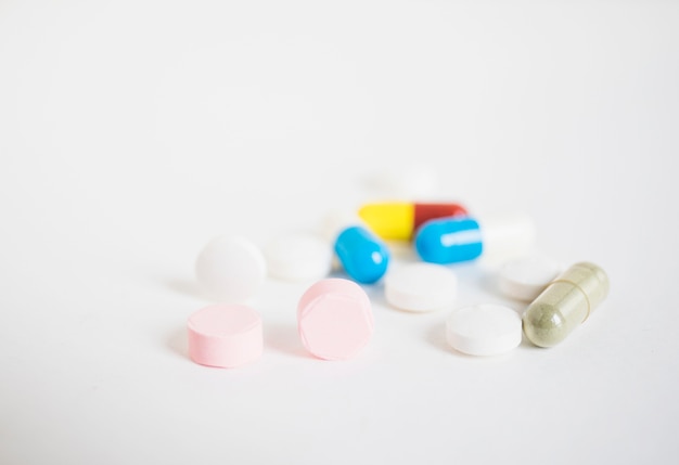 Free photo colorful pills and capsules on white background