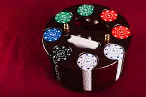 Free photo colorful poker chip set in carousel case