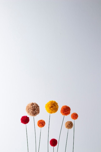 Colorful pom poms arrangement flat lay