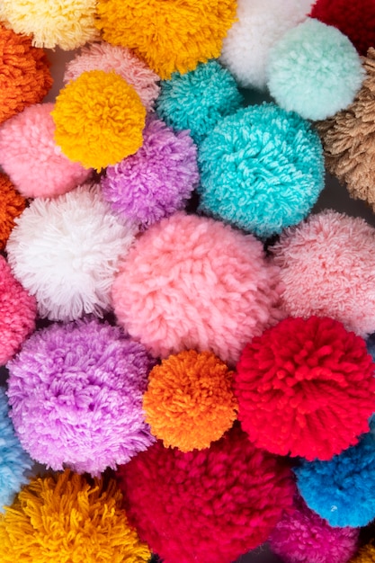 Free photo colorful pom poms arrangement above view