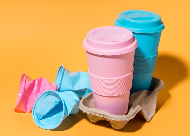 Free photo colorful reusable cups on the table