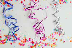 Free photo colorful ribbons and confetti