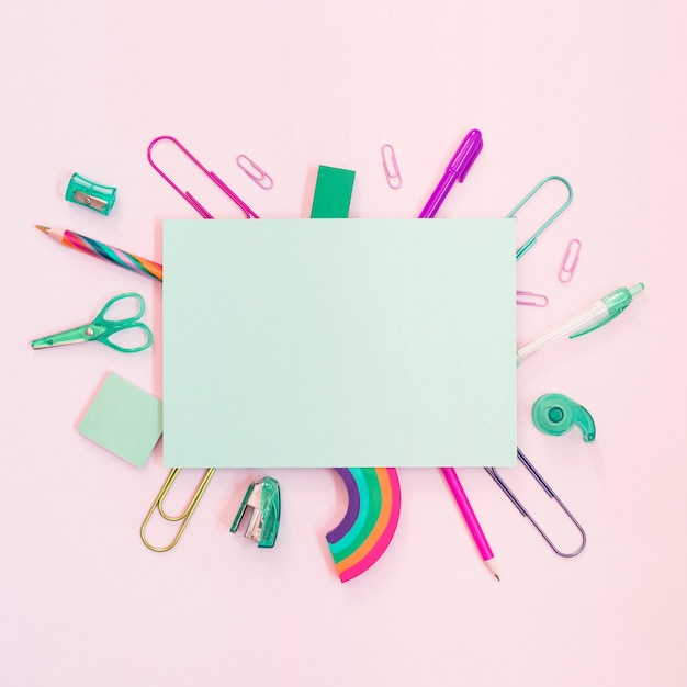 Free photo colorful school supplies with paper