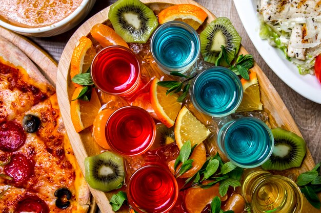 Free photo colorful shots with fruits top view