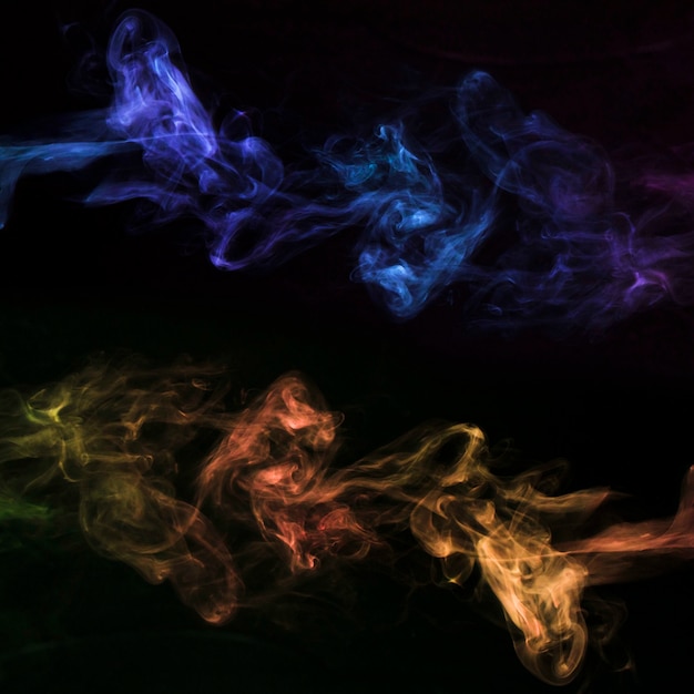 Free Photo colorful smoke movement on black background