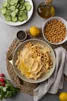 Free photo colorful and tasty hummus with ingredients