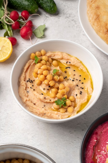 Free photo colorful and tasty hummus with ingredients