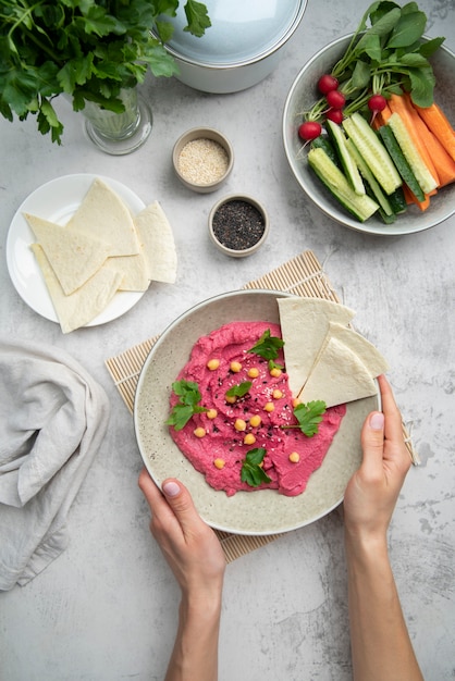 Colorful and tasty hummus with ingredients