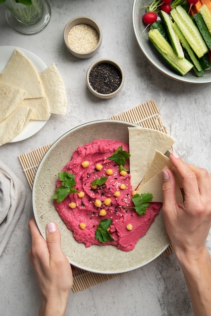 Colorful and tasty hummus with ingredients