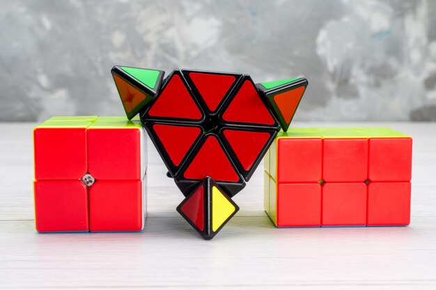 colorful toy constructions designed shaped reded on light, toy plastic