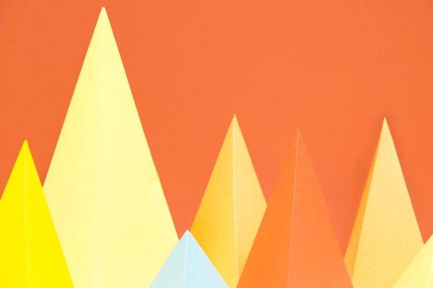 Free Photo colorful triangle paper pack on desk