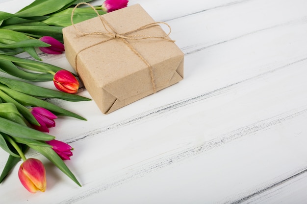 Colorful tulips and gift box