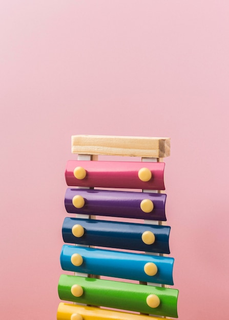 Free Photo colorful xylophone arrangement on pink