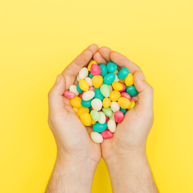 Colourful candies in palms