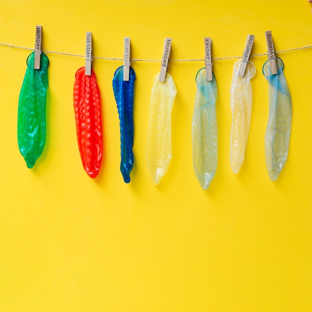 Free Photo colourful condoms hanging on clothesline