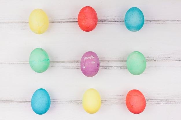 Free photo colourful easter eggs on white table