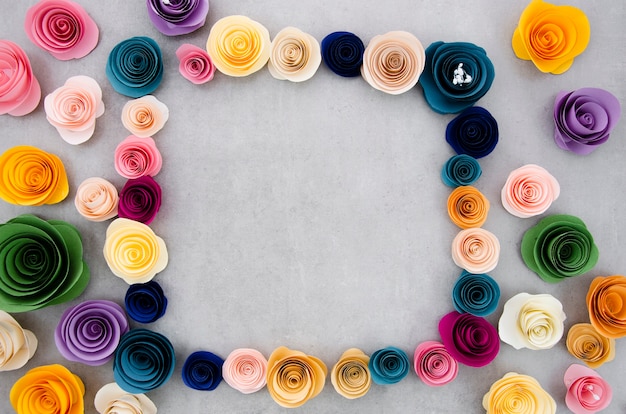 Colourful floral frame on cement background